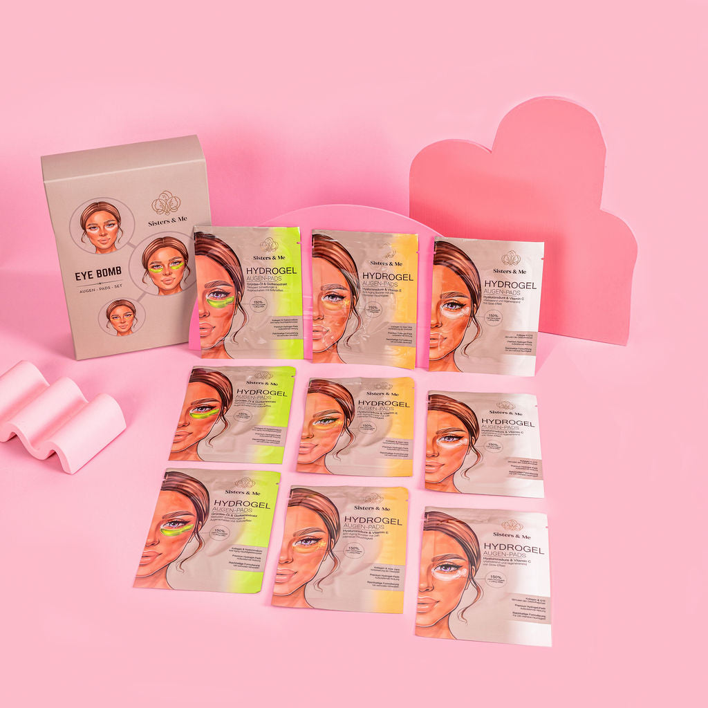 Mehrfarbiges Sisters & Me Eye Bomb Set mit ausgepackten Hydrogel Augen-Pads auf rosa Hintergrund